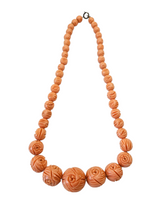 Load image into Gallery viewer, 1940s Carved Coral Pink Galalith Necklace
