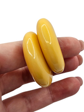 Load image into Gallery viewer, 1940s Buttermilk Yellow Bakelite Hoop Earrings
