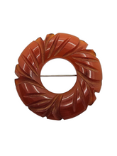 Load image into Gallery viewer, 1940s Rust Bakelite Carved Circle Brooch
