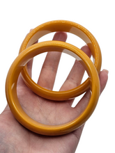 Load image into Gallery viewer, 1940s Egg Yolk Bakelite Bangle Set
