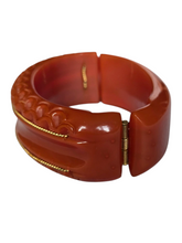 Load image into Gallery viewer, 1940s Dark Caramel Carved Bakelite Clamper
