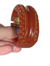 Load image into Gallery viewer, 1940s Dark Caramel Carved Bakelite Clamper
