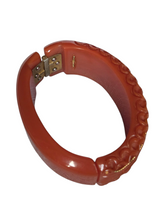 Load image into Gallery viewer, 1940s Dark Caramel Carved Bakelite Clamper
