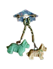 Load image into Gallery viewer, 1940s Celluloid Dog and Kennel Brooch
