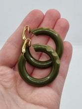 Load image into Gallery viewer, 1940s Carved Bakelite Moss Green Earrings
