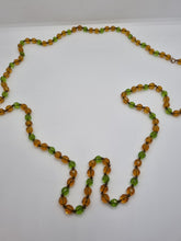 Load image into Gallery viewer, 1930s Deco Orange and Green Glass Long Knotted Necklace
