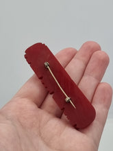 Load image into Gallery viewer, 1940s Carved Red Bakelite Bar Brooch
