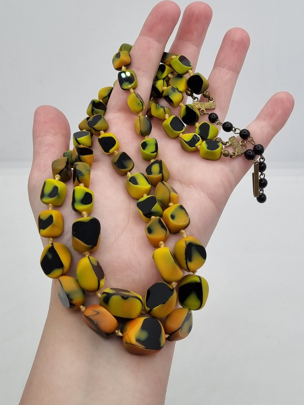1950s Black, Yellow and Orange Marbled Knotted Glass Necklace
