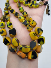 Load image into Gallery viewer, 1950s Black, Yellow and Orange Marbled Knotted Glass Necklace

