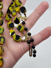 Load image into Gallery viewer, 1950s Black, Yellow and Orange Marbled Knotted Glass Necklace
