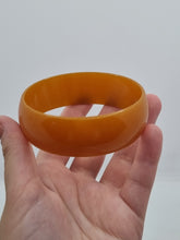 Load image into Gallery viewer, 1940s Huge Thin Orange Bakelite Bangle
