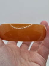 Load image into Gallery viewer, 1940s Huge Thin Orange Bakelite Bangle
