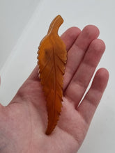 Load image into Gallery viewer, 1930s HUGE Butterscotch Carved Bakelite Curved Leaf Dress Clip
