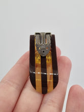 Load image into Gallery viewer, 1940s Brown and Apple Juice Laminated Bakelite Dress Clip
