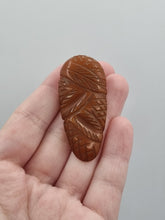 Load image into Gallery viewer, 1940s Dark Marmalade Carved Bakelite Dress Clip
