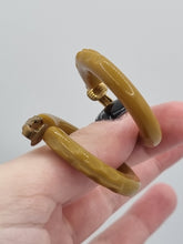 Load image into Gallery viewer, 1940s Olive Green/Mustard Carved Bakelite Earrings
