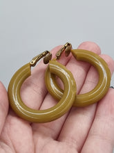 Load image into Gallery viewer, 1940s Olive Green/Mustard Carved Bakelite Earrings
